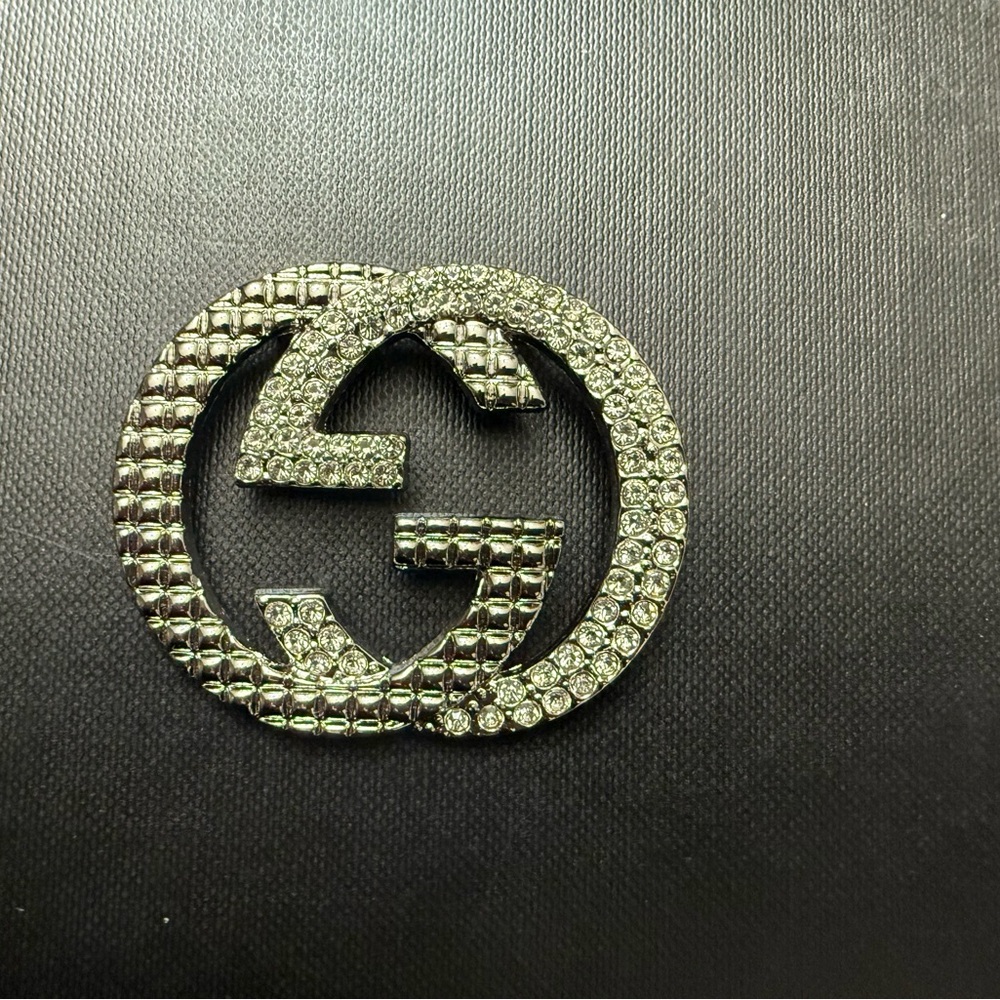 Brand new Gucci  Silver Crystal Brooch Aprox  1.5”h 2”h  no box
